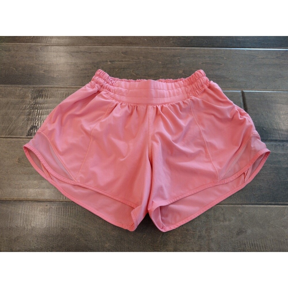 LULULEMON Women' Hotty Hot Low Rise peach 4" shorts - size 4 EEUC